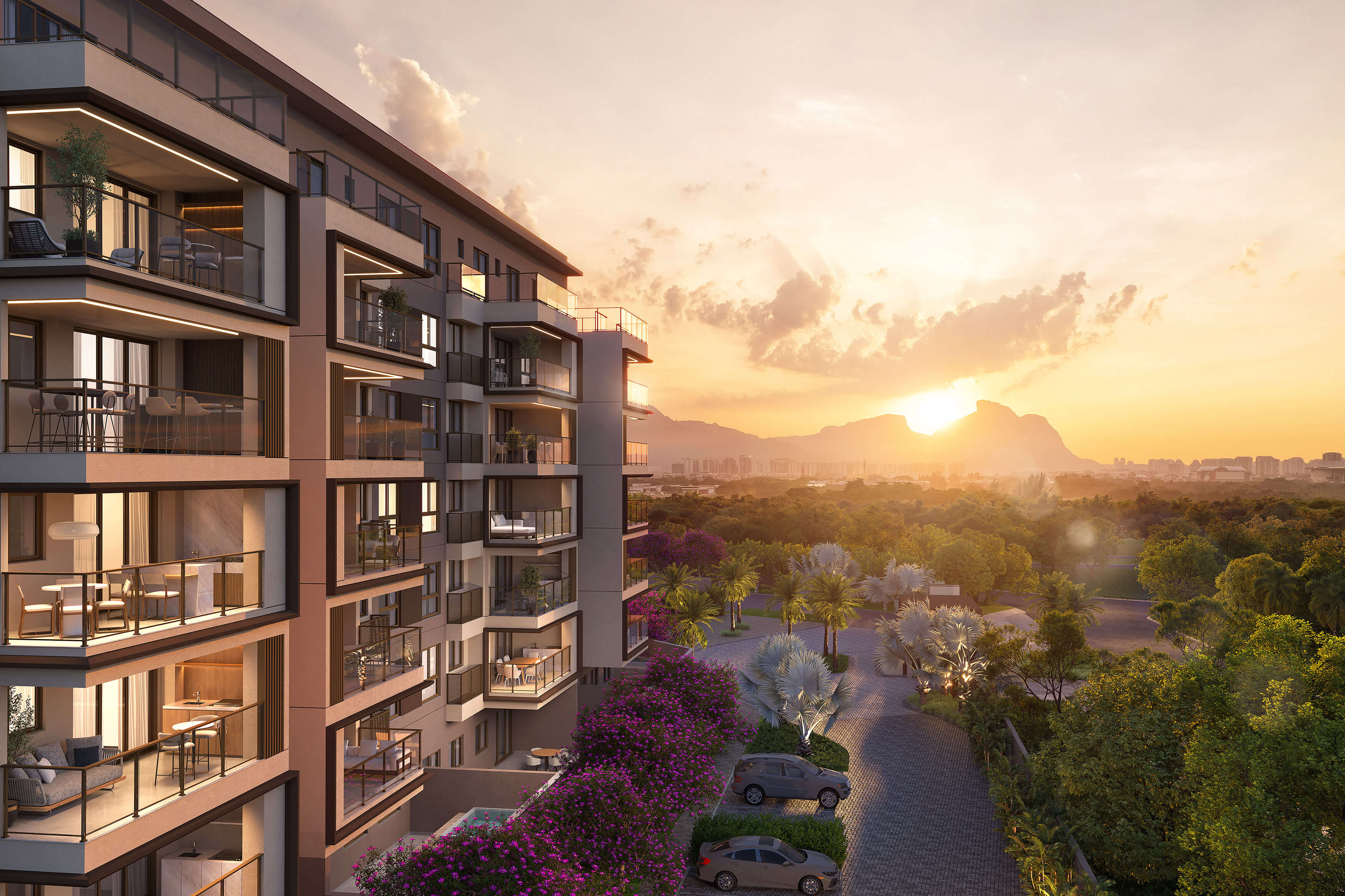 Fachada do Woods Park Design ao entardecer, com varandas integradas ao verde da Barra da Tijuca
